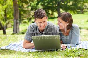 Lovers working on their laptop