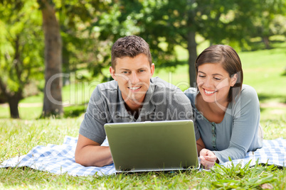 Lovers working on their laptop