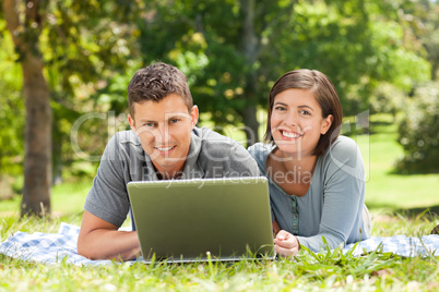 Lovers working on their laptop