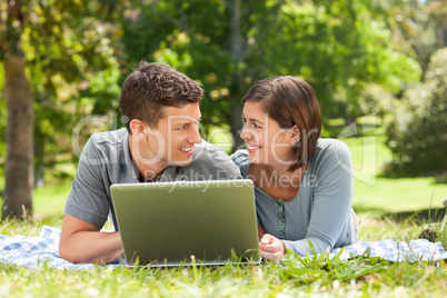 Lovers working on their laptop