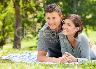 Couple lying down in the park