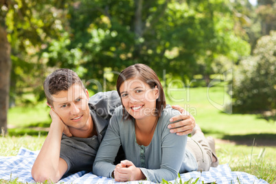 Couple lying down in the park