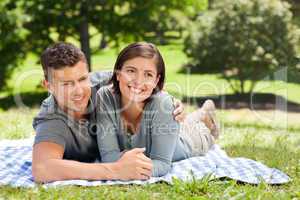 Couple lying down in the park