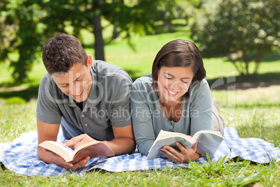 Couple reading a book Couple reading a book