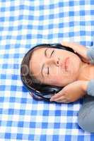 Woman listening to some music in the park