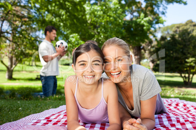 Mother and daughter having fun in the park