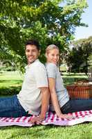 Lovers picnicking in the park