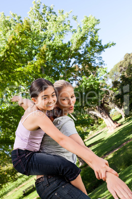 Daughter playing with her mother