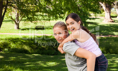 Daughter playing with her mother