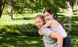 Daughter playing with her mother