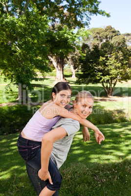 Daughter playing with her young mother