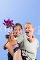 Mother and her daughter with a windmill