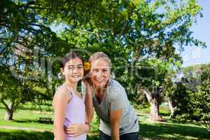 Cute daughter with her mother in the park