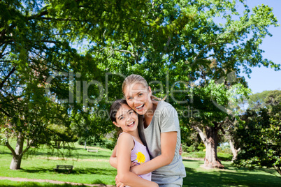 Cute daughter with her mother in the park