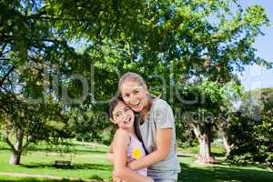 Cute daughter with her mother in the park