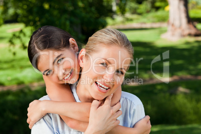 Cute daughter with her mother in the park