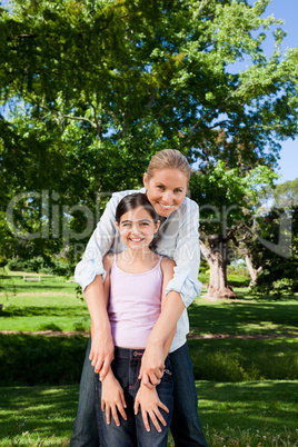 Cute daughter with her mother in the park