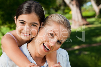 Cute daughter with her mother in the park