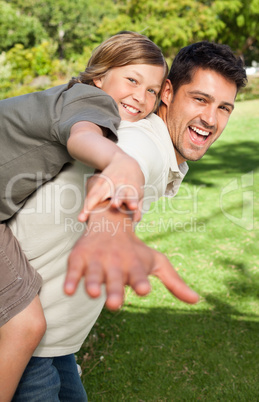 Father playing with his son in the park