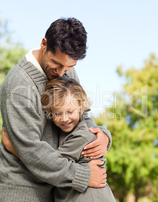 Son embracing his father