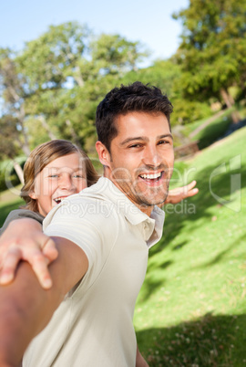 Father playing with his son in the park