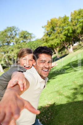 Father playing with his son in the park