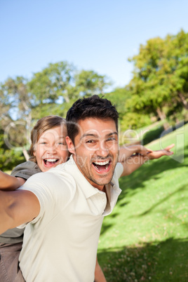 Father playing with his son in the park