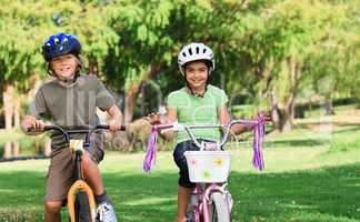 Brother and  sister with their bikes