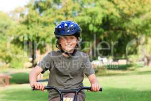 Little boy with his bike