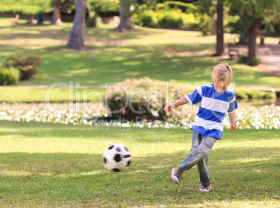 Boy playing football in the park