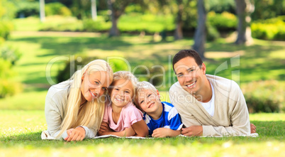 Family lying down in the park