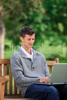 Concentrated man working on his laptop