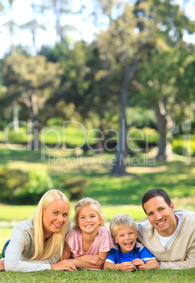 Family lying down in the park
