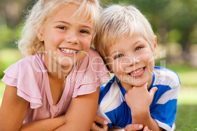 Boy with his sister in the park