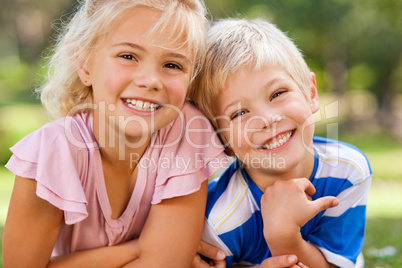 Boy with his sister in the park