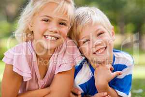 Boy with his sister in the park