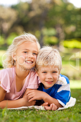 Boy with his sister in the park