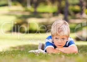 Boy lying down in the park