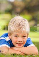 Boy lying down in the park