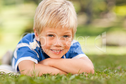 Boy lying down in the park