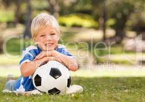 Boy with his ball in the park