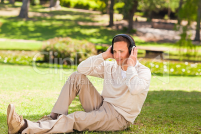 Man listening to music in the park