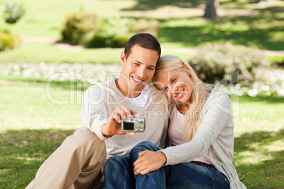 Young couple taking a photo of themselves