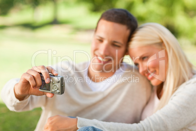 Young couple taking a photo of themselves