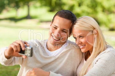 Young couple taking a photo of themselves