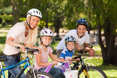 Family in the park with their bikes