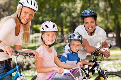 Family in the park with their bikes