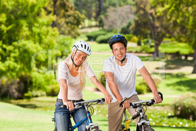 Couple in the park with their bikes