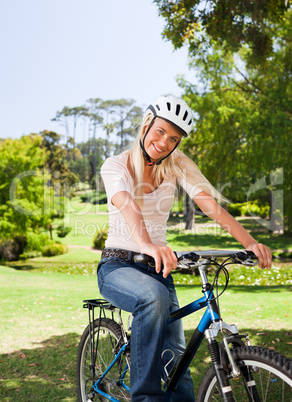 Woman in the park with her bike