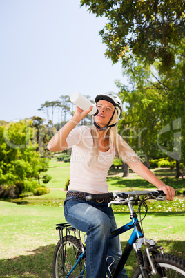 Woman in the park with her bike